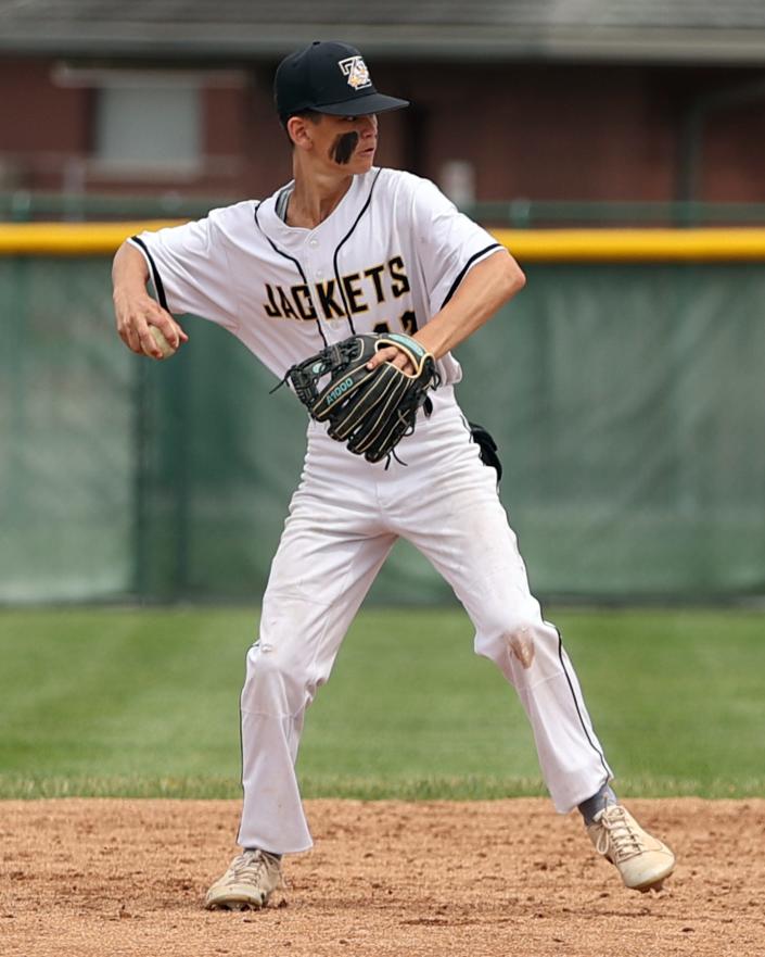 Taylor second baseman Nick Backscheider throws to first for the putout in the game between Badin and Taylor high schools at Mason High School, June 2, 2022.