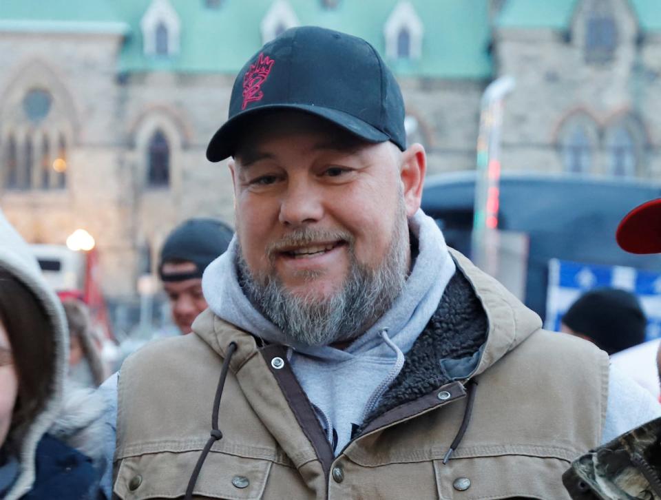 Pat King, one of the organizers of the protest, poses for photos in front of Parliament Hill as truckers and their supporters continue to protest against coronavirus disease (COVID-19) vaccine mandates in Ottawa, Ontario, Canada, Feb. 16, 2022. 