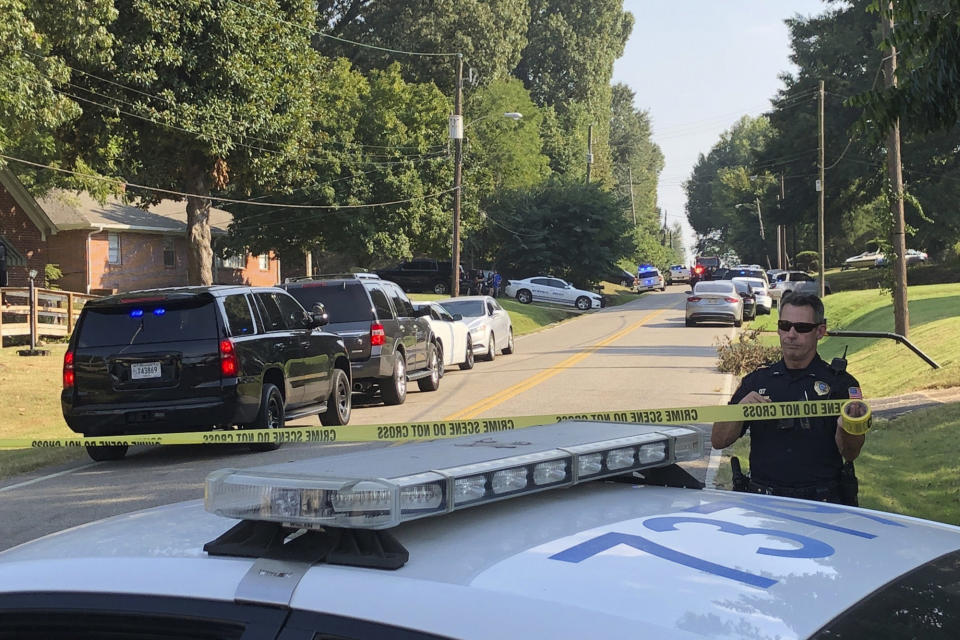 Police cordon off the scene of a shooting in Memphis, Tenn., on Wednesday, Sept. 18, 2019. Officials say two deputies have been injured and a suspect has died in the shooting. (AP Photo/Adrian Sainz)