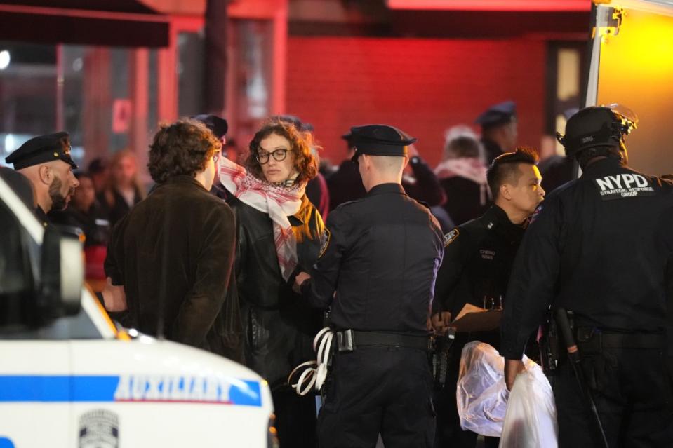 Members of the New York Police Department detain protesters who did not leave the encampment. James Keivom