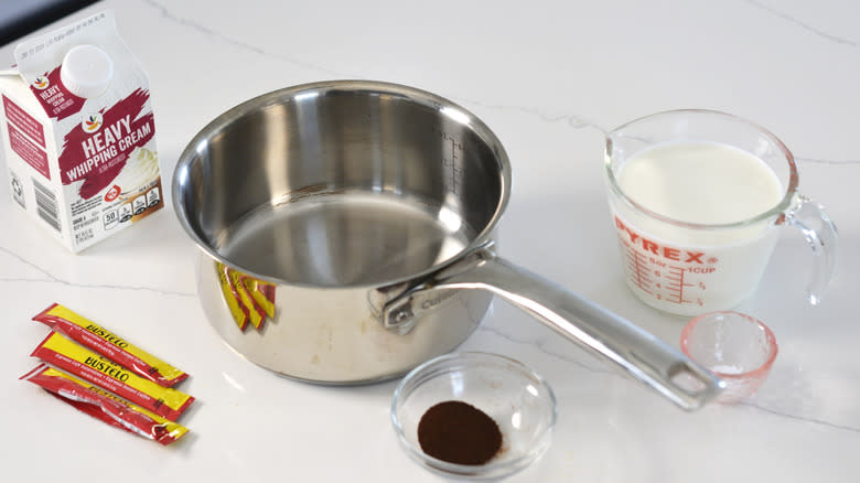 Saucepan with heavy whipping cream and espresso powder