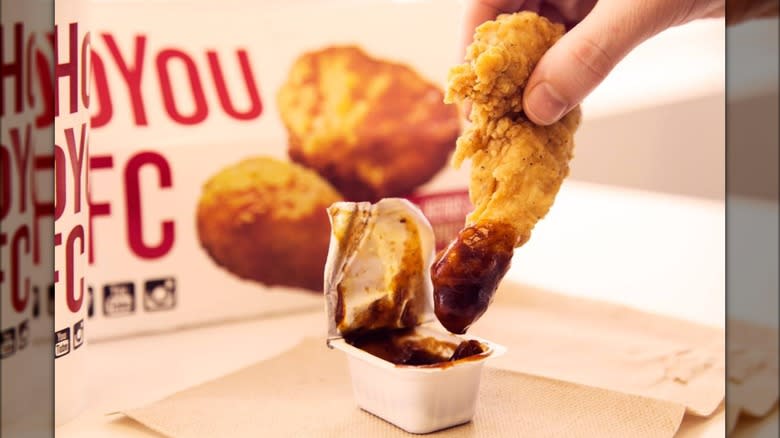 KFC chicken dipping into Honey BBQ sauce