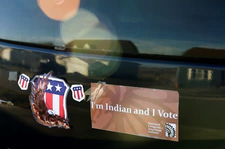 A bumper sticker stating "I'm Indian and I vote" adorns a car on the Fort Berthold Reservation in North Dakota, November 1, 2014. REUTERS/Andrew Cullen