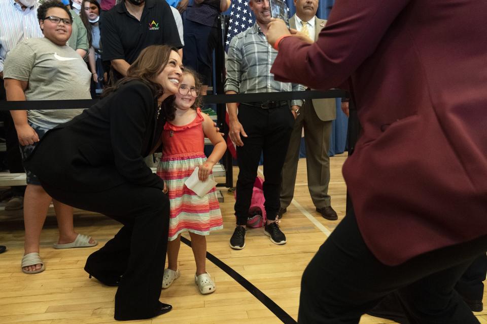 Vice President Kamala Harris leans in for a photograph with Stella Quatrini, after Harris spoke about the child tax credit at Brookline Memorial Recreation Center, Monday June 21, 2021, in Pittsburgh. (AP Photo/Jacquelyn Martin)