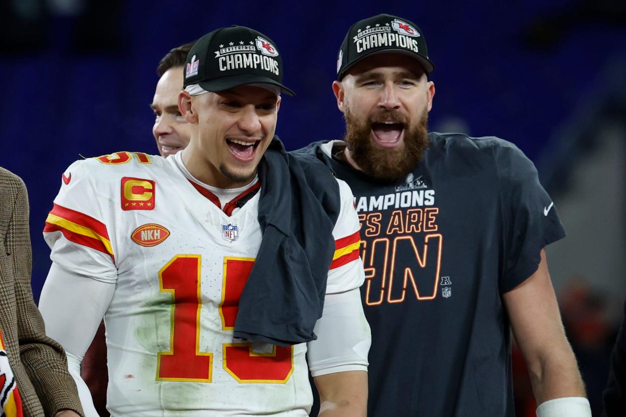 Kansas City Chiefs quarterback Patrick Mahomes, left, and tight end Travis Kelce celebrate on stage before the annual presentation of the Lamar Hunt Trophy, which goes to the AFC champion.