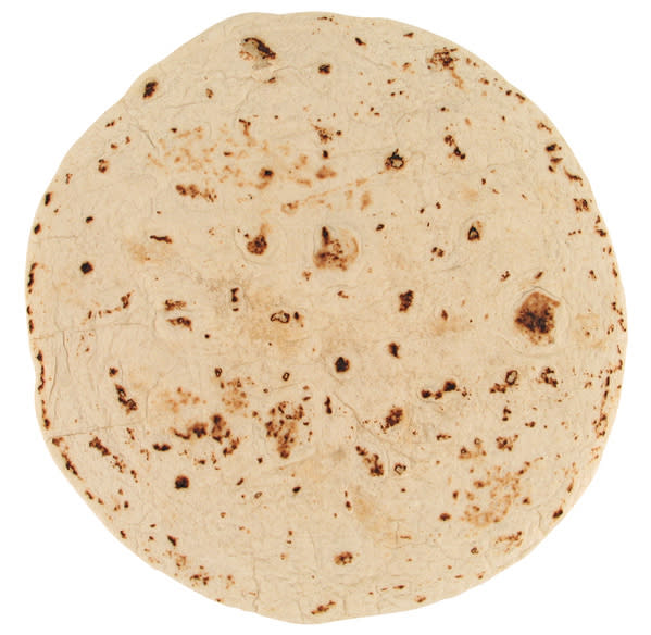 A plain tortilla wrap with no visible fillings