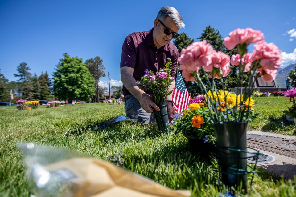 Allen Back visits his parents’ and aunt’s grave at Larkin Sunset Gardens Cemetery in Sandy on Monday, May 31, 2021. | Annie Barker, Deseret News