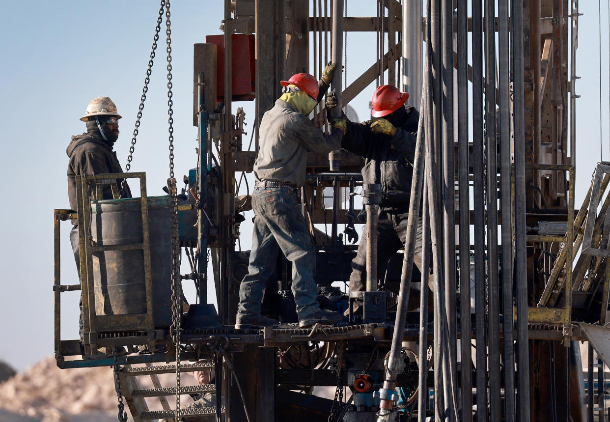 MIDLAND, TEXAS - MARCH 12: Workers place pipe into the ground on an oil drilling rig set up in the Permian Basin oil field on March 12, 2022 in Midland, Texas.  President Joe Biden imposed a ban on Russian oil, the world’s third-largest oil producer, which may mean that oil producers in the Permian Basin will need to pump more oil to meet demand. The Permian Basin is the largest petroleum-producing basin in the United States. (Photo by Joe Raedle/Getty Images)
