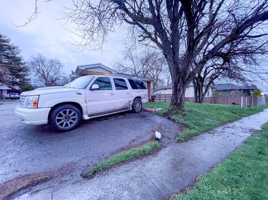 A white SUV with rear-end damage after being hit on 900 West (SLCPD photo, March 31, 2024)