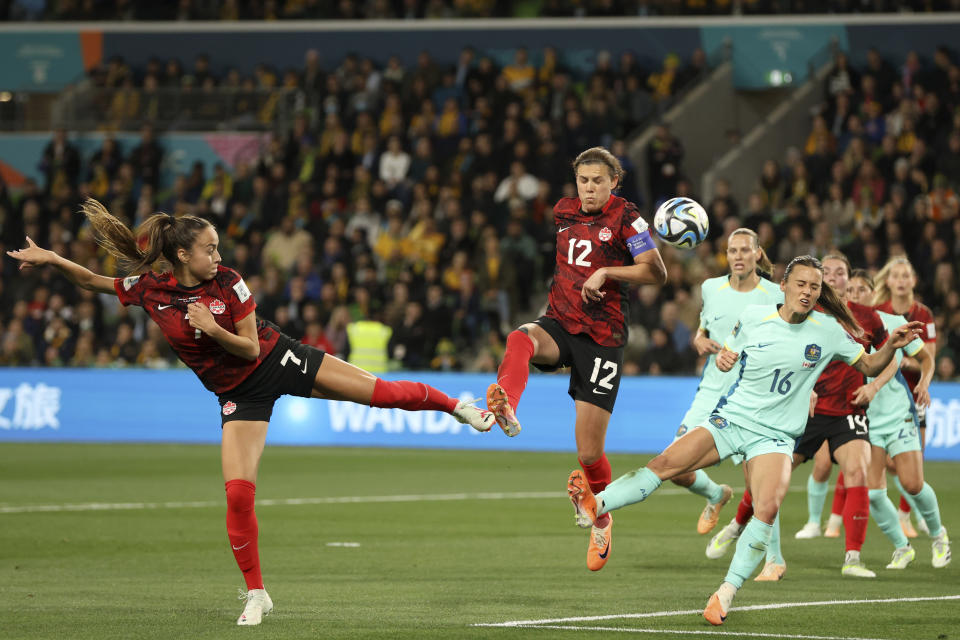 Australia's Hayley Raso, foreground right, tries to block Canada's Julia Grosso, left, and Christine Sinclair during the Women's World Cup Group B soccer match between Australia and Canada in Melbourne, Australia, Monday, July 31, 2023. (AP Photo/Hamish Blair)