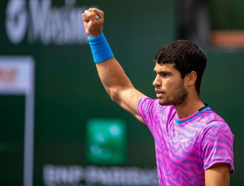 Carlos Alcaraz celebrates a second consecutive game win against Daniil Medvedev after allowing Medvedev to open the first set with three straight game wins during the ATP final of the BNP Paribas Open in Indian Wells, Calif., Sunday, March 17, 2024.