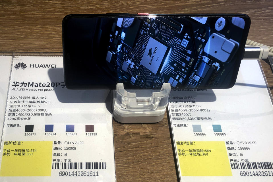 A Huawei Mate20P smartphone model showing its own Kirin chip processor is displayed at an electronic store in Beijing, Monday, May 20, 2019. Google assured users of Huawei smartphones on Monday the American company's basic services will work on them following U.S. government cubs on doing business with the Chinese tech giant. The announcement highlighted the potential impact on global consumers and technology industries of the Trump administration's decision to tighten controls on Huawei Technologies Ltd., which Washington says is a security threat. (AP Photo/Andy Wong)