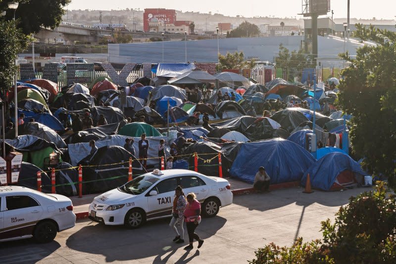 Hundreds of asylum seekers set up tents by the port of entry at El Chaparral plaza in Tijuana, Mexico on March 26, 2021. File Photo by Ariana Drehsler/UPI