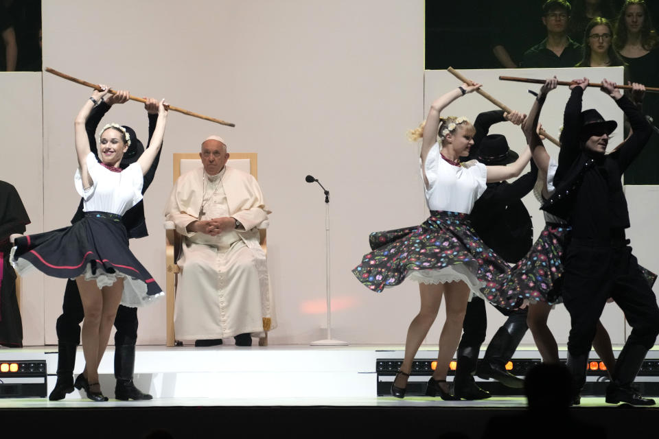 Pope Francis looks at dancers during a meeting with young people at the Laszlo Papp Budapest Sports Arena, in Budapest, Hungary, Saturday, April 29, 2023. (AP Photo/Andrew Medichini)