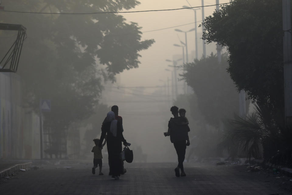 FILE - Palestinians flee the Naser neighborhood following Israeli airstrike on Gaza City, Wednesday, Nov. 8, 2023. Israel's military offensive has turned much of northern Gaza into an uninhabitable moonscape. When the war ends, any relief will quickly be overshadowed by the dread of displaced families for their future. (AP Photo/Abed Khaled, File)