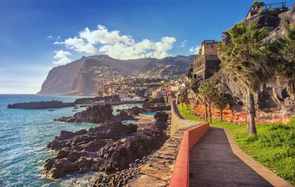 the beautifil promenade walk from funchal lido into the fishing viallge of camara de lobos on madeira at sunset