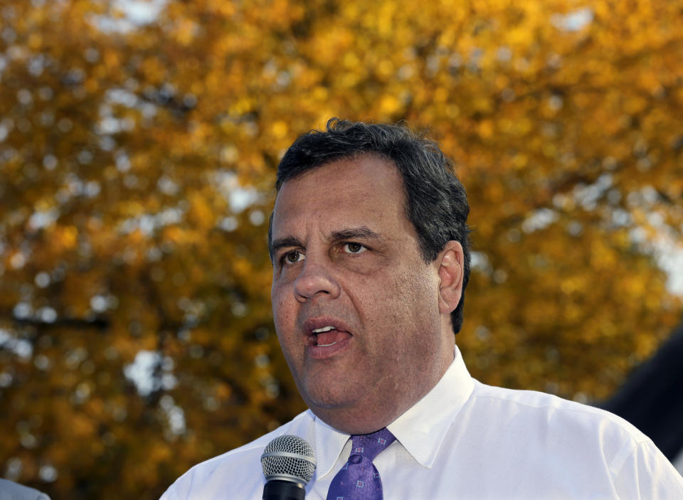 New Jersey Gov. Chris Christie addresses a gathering while visiting the Superstorm Sandy-damaged home of John and Angela Ciangiotto in Union Beach, N.J., Tuesday, Oct. 29, 2013. 