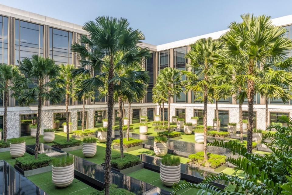 Will the palm-filled courtyard offer a serene stage for a dark satire of elite travelers? KENSEET/Courtesy of the Four Seasons