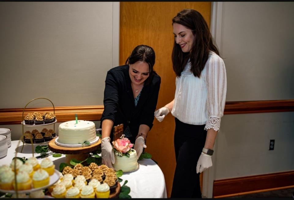 Laura Shadler (left) and Tiffany Brown make sure all the details are perfect.