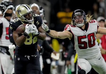 FILE PHOTO: Nov 22, 2018; New Orleans, LA, USA; New Orleans Saints tight end Benjamin Watson (82) catches a pass over Atlanta Falcons defensive end Brooks Reed (50) during the third quarter at the Mercedes-Benz Superdome. Mandatory Credit: Derick E. Hingle-USA TODAY Sports