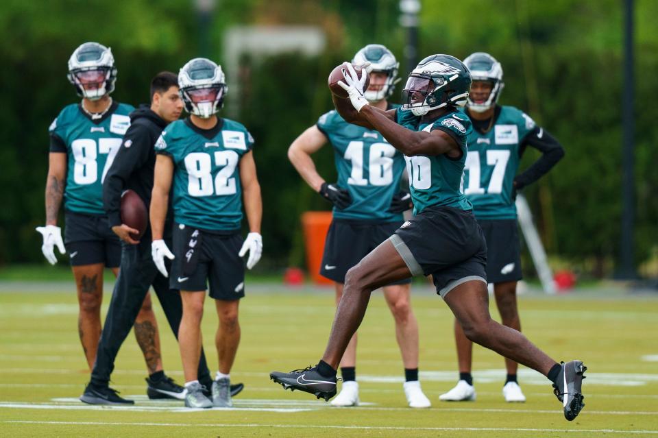 Philadelphia Eagles' Joseph Ngata, second from right, conducts a drill as teammates look on during the NFL's rookie football minicamp, Friday, May 5, 2023, in Philadelphia.