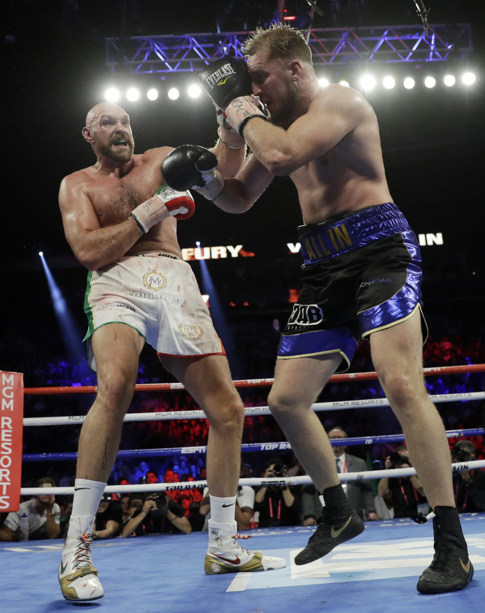 Tyson Fury, left, of England, fights Otto Wallin, of Sweden, during their heavyweight boxing match Saturday, Sept. 14, 2019, in Las Vegas. (AP Photo/Isaac Brekken)
