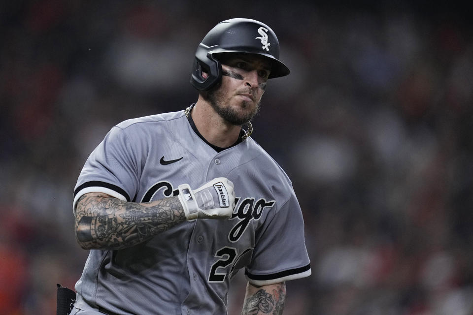 Chicago White Sox's Yasmani Grandal celebrates after hitting a solo home run off Houston Astros relief pitcher Rafael Montero during the eighth inning of a baseball game Thursday, March 30, 2023, in Houston. (AP Photo/Kevin M. Cox)