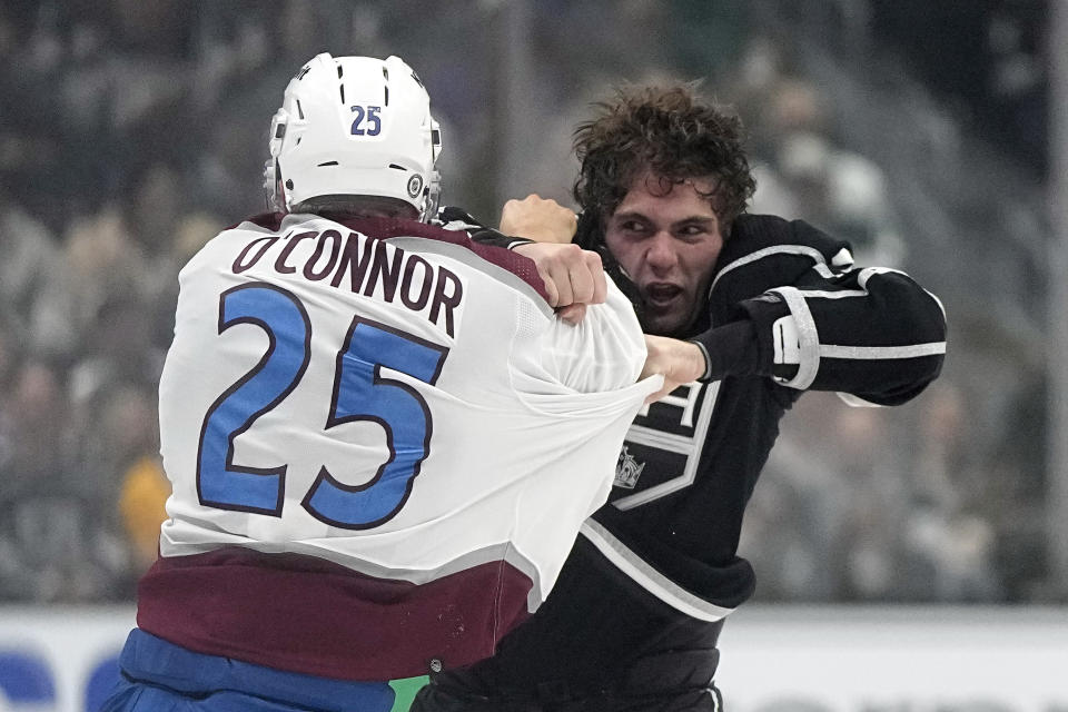 Colorado Avalanche right wing Logan O'Connor, left, and Los Angeles Kings right wing Alex Laferriere fight during the second period of an NHL hockey game Wednesday, Oct. 11, 2023, in Los Angeles. (AP Photo/Mark J. Terrill)