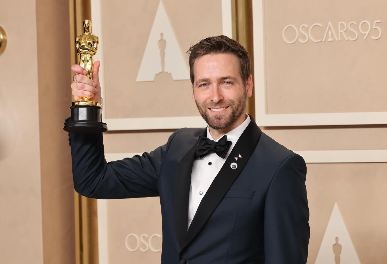 Paul Rogers poses in the press room during the 95th Academy Awards on March 12, 2023, in Hollywood, California.