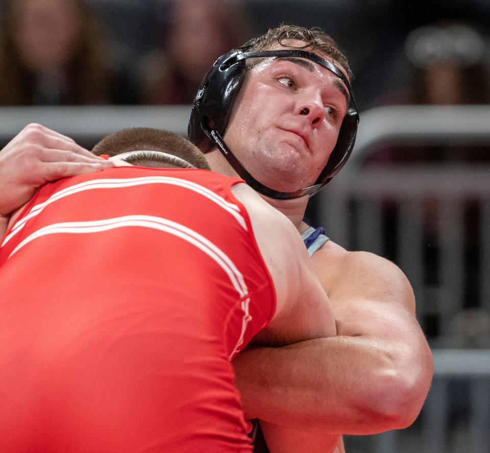 Leighton Jones of Brownsburg High School (top), winner of this 285 pound match, controls Liam Begley of Crown Point High School, at Indianapolis’ Gainbridge Fieldhouse, Friday, Feb. 18, 2022, during the preliminary round of the IHSAA wrestling state finals. 