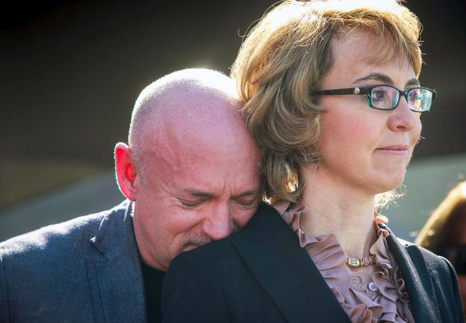 Mark Kelly supports his wife, former Rep. Gabby Giffords, as they listen to shooting victims. Other Jan. 8, 2011, shooting survivors, family members and supporters of their Americans For Responsible Solutions addressed the media at the north Tucson Safeway store.