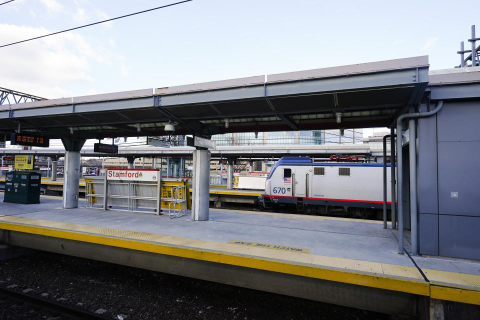 A train arrives at the Stamford train station Tuesday, Dec. 29, 2020, in Stamford, Conn. With many New Yorkers moving to neighboring Connecticut during the pandemic, especially Fairfield County, it's becoming more challenging for people to find affordable homes to buy. (AP Photo/Frank Franklin II)