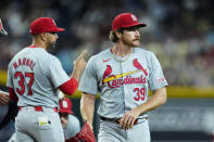 St. Louis Cardinals pitcher Miles Mikolas (39) leaves the game as Cardinals manager Oliver Marmol (37) points to the bullpen for a new pitcher during the fifth inning of a baseball game against the Arizona Diamondbacks Sunday, April 14, 2024, in Phoenix. (AP Photo/Ross D. Franklin)