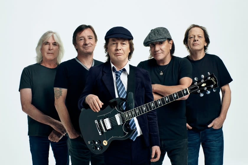 AC/DC's Cliff Williams, from left, Phil Rudd, Angus Young, Brian Johnson and Stevie Young in a 2020 handout photo.