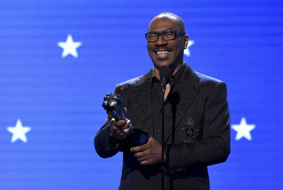 FILE - In this Jan. 12, 2020, file photo, Eddie Murphy accepts the lifetime achievement award at the 25th annual Critics' Choice Awards in Santa Monica, Calif. Murphy will be inducted into the NAACP Image Awards Hall of Fame this month. The NAACP announced Thursday, March 11, 2021, that Murphy will be inducted during the March 27 ceremony, which will air on CBS. (AP Photo/Chris Pizzello, File)