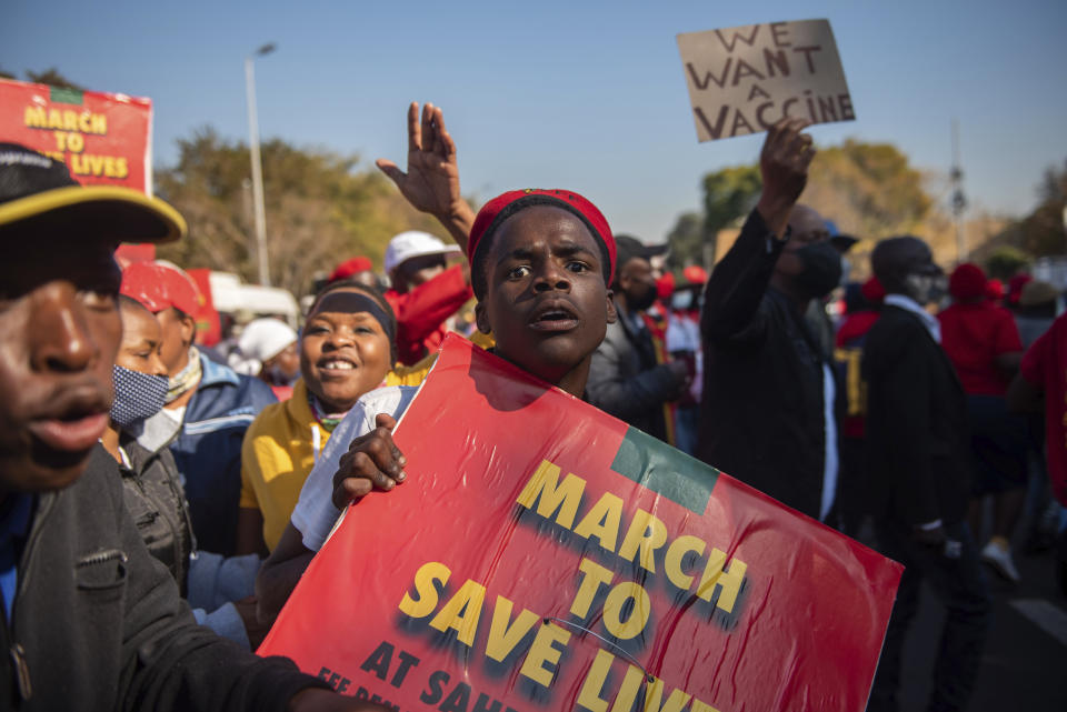 FILE — In this Friday, June 25, 2021 file photo members of the Economic Freedom Fighters stage a protest march in Pretoria, South Africa, demanding that vaccines from China and Russia be included in the country's vaccine rollout program. The African Union special envoy tasked with leading efforts to procure COVID-19 vaccines for the continent is blasting Europe as Africa struggles amid a crushing third wave of infections. (AP Photo Alet Pretorius, File)