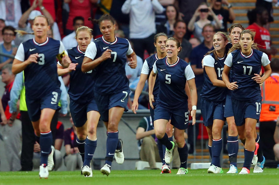 LONDON, ENGLAND - AUGUST 09: Christie Rampone #3, Shannon Boxx #7, Kelley O'Hara #5, Abby Wambach #14, Tobin Heath #17 celebrate the goal by Carli Lloyd #10 of United States in the first half against Japan during the Women's Football gold medal match on Day 13 of the London 2012 Olympic Games at Wembley Stadium on August 9, 2012 in London, England. (Photo by Julian Finney/Getty Images)