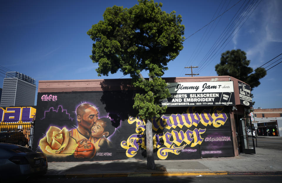 A mural depicting deceased NBA star Kobe Bryant and his daughter Gianna, painted by @sloe_motions, is displayed on a building in Los Angeles. (Mario Tama/Getty Images)