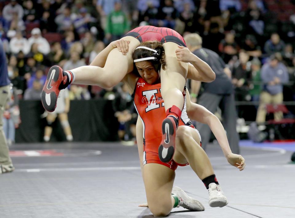 Hueneme High's Audrey Diaz tosses her opponent over her shoulders during a 137-pound match at the CIF-State Wrestling Championships at Mechanics Bank Arena in Bakersfield. Diaz, who won a CIF-SS title and reached the state meet for the second straight season, went 1-2.