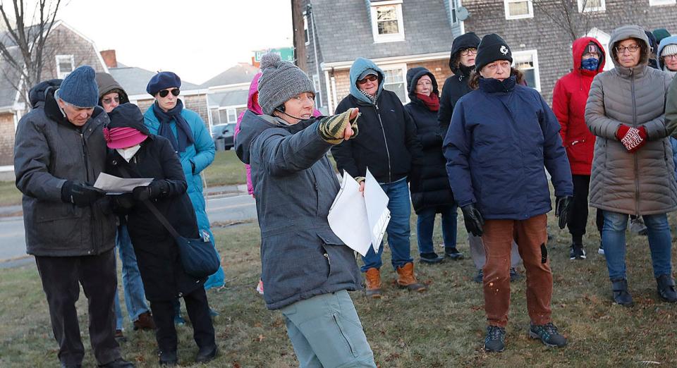 Maura O'Gara leads a winter solstice walking tour for the Quincy Environmental Treasures Program on Dec. 21. The tour included the Sailors Snug Harbor Cemetery, where Capt. Hanson Gregory, inventor of the doughnut, is buried.