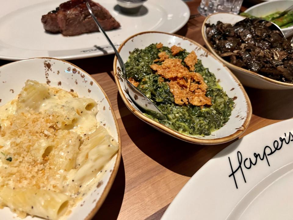 The macaroni and cheese, creamed spinach and sauteed mushrooms at Harper's Nashville steakhouse on Nov. 13, 2023