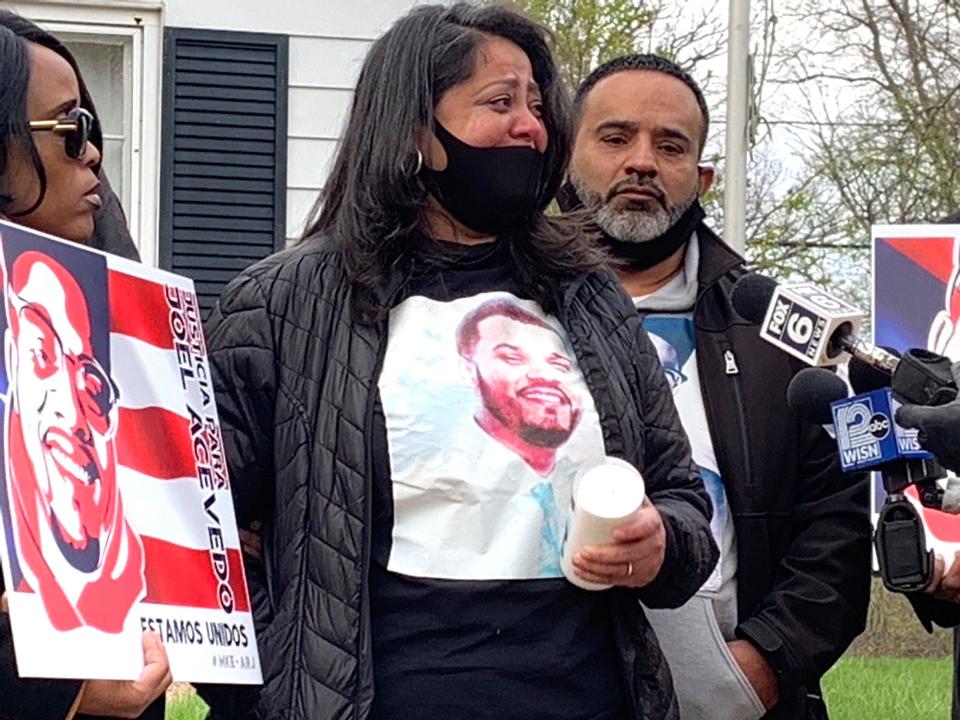 Maribel and Jose Acevedo, Joel Acevedo's parents, speak as family and friends gather on April 19, 2021, in the 4500 block of West Cleveland Avenue to mark the one-year anniversary of the chokehold that led to his death.