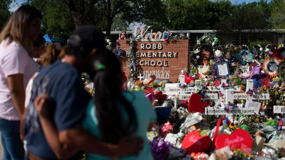 PHOTO: People visit a memorial at Robb Elementary School in Uvalde, Texas, on June 2, 2022, to pay their respects to the victims killed in a school shooting. (Jae C. Hong/AP, FILE)