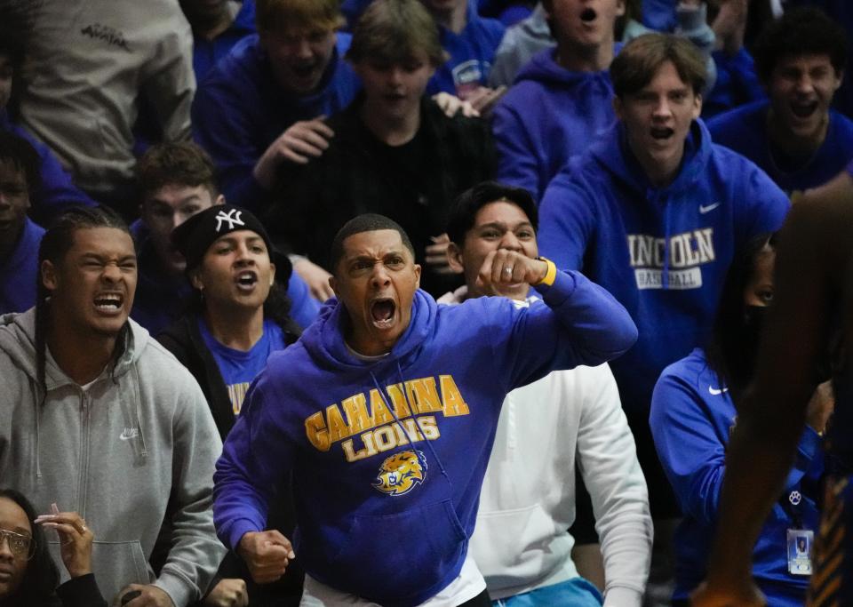 Sat., Mar. 12, 2022; Columbus, Ohio, USA; Gahanna Lincoln Lions fans cheer after a basket during the third quarter of a OHSAA Boys' Basketball regional final between the Pickerington Central Tigers and the Gahanna Lincoln Lions at Ohio Dominican University Alumni Hall.