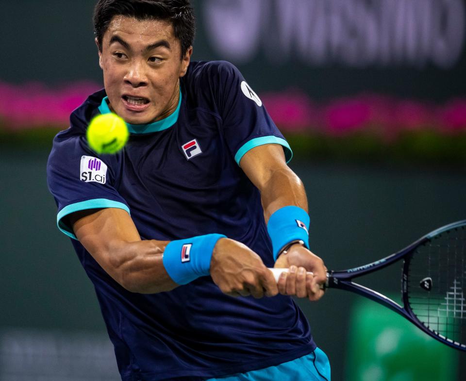 Brandon Nakashima of the United States hits to Daniil Medvedev of Russia during their second-round match at the BNP Paribas Open at the Indian Wells Tennis Garden in Indian Wells, Calif., Friday, March 10, 2023. 