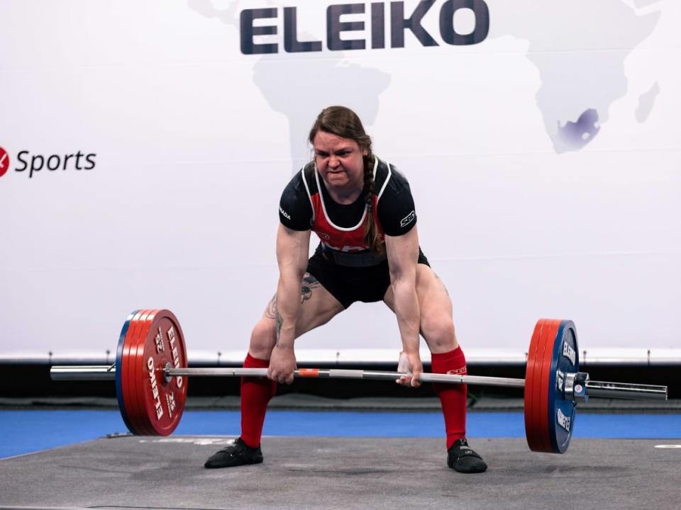 Danielle Philibert, a New Brunswick woman who spends her days working as an aquatic toxicologist, has a hobby on the side: winning medals at international powerlifting competitions. (Submitted by Danielle Philibert - image credit)