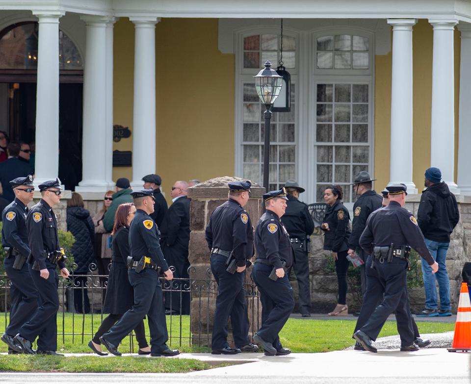 From Jefferson Street, near Pond Street, people and law enforcement officers wait in line during the viewing of Pennsylvania State Trooper Martin Mack III, held at the Wade Funeral Home in Bristol Borough, on Wednesday, March 30, 2022