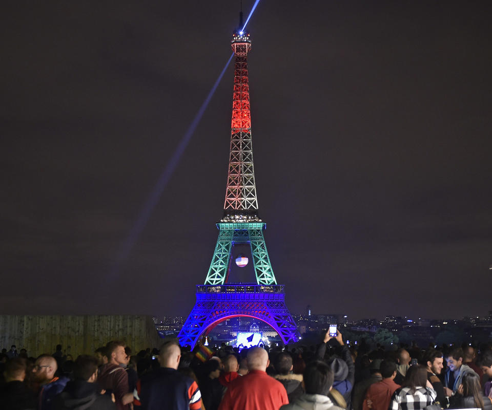 <p>The Eiffel Tower in Paris, France, shines in the colors of a rainbow to honor victims of Sunday’s mass shooting at an Orlando gay club, Monday, June 13, 2016. (AP Photo/Martin Meissner) </p>