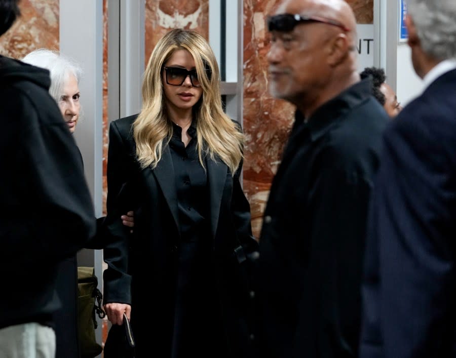 Khazar Elyassnia, center, arrives for the arraignment of Nima Momeni, her brother, at the Hall of Justice in San Francisco, Thursday, May 18, 2023. (AP Photo /Godofredo A. Vásquez)