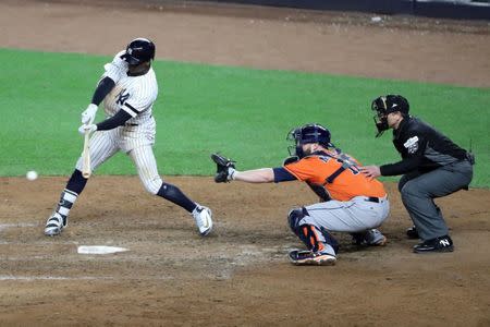 Oct 17, 2017; Bronx, NY, USA; New York Yankees shortstop Didi Gregorius (18) singles against the Houston Astros during the eighth inning in game four of the 2017 ALCS playoff baseball series at Yankee Stadium. Mandatory Credit: Anthony Gruppuso-USA TODAY Sports